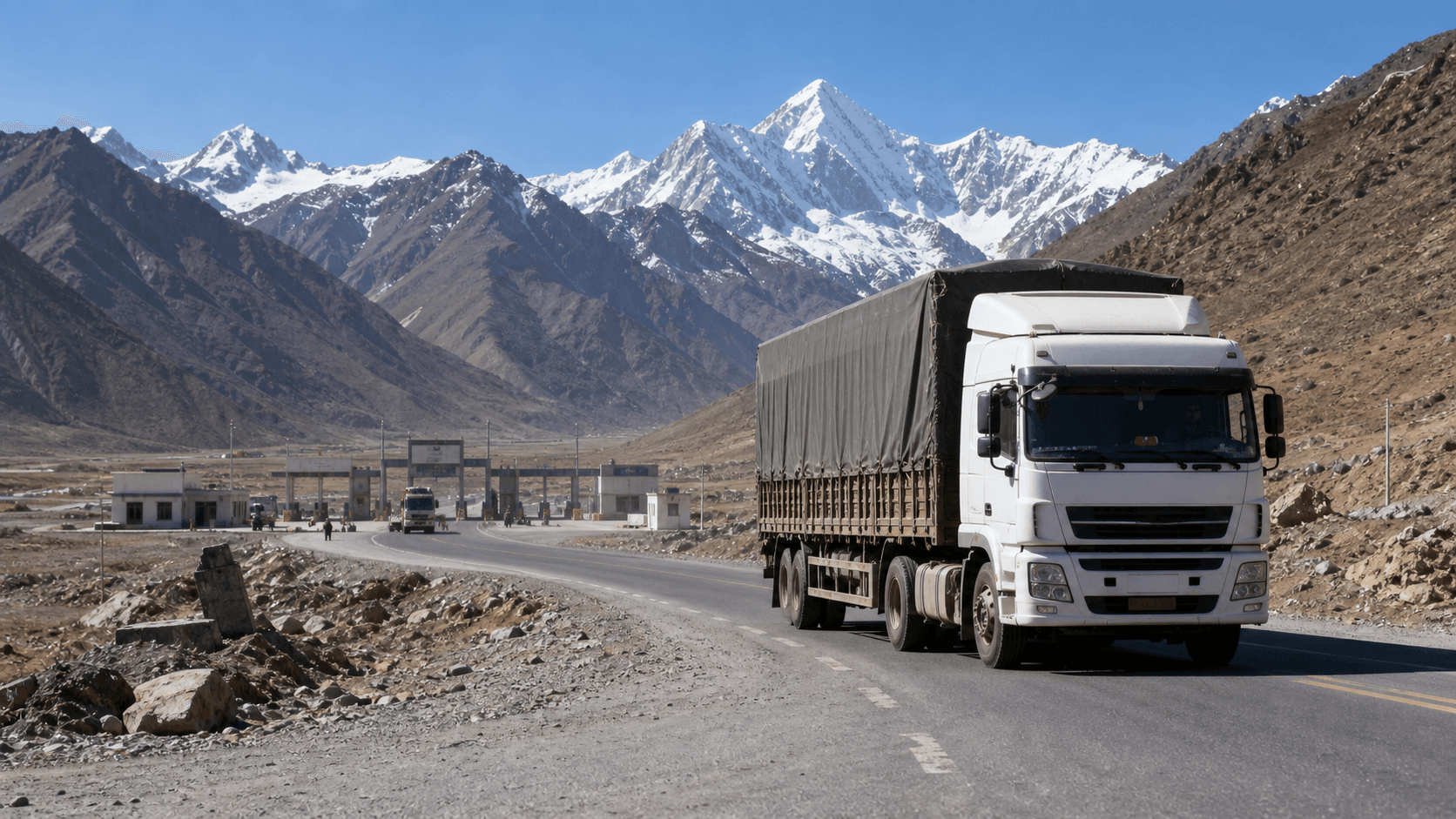Cross-border cargo truck moving through a high-altitude China-Nepal trade corridor
