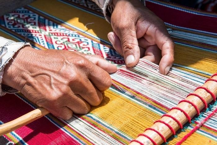 Nepali artisans creating traditional handicrafts, carpets, and paper products for global export.