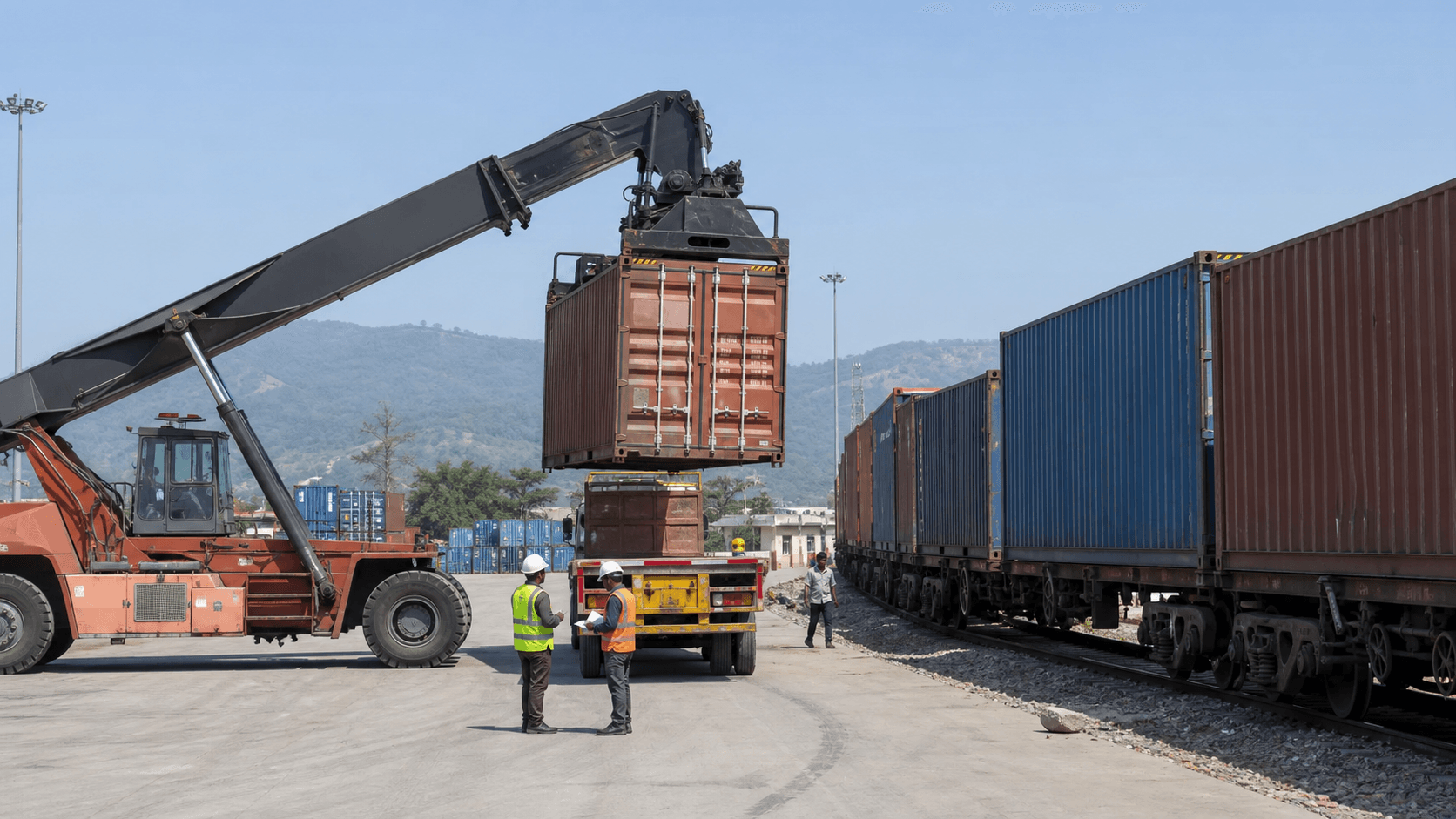 Sealed container transferring from an inland freight train to a truck on the Nepal trade corridor